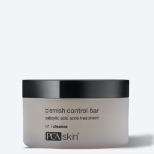 A container of PCA Skin Blemish Control Bar, a salicylic acid acne cleanser with a black lid and white label, pairs perfectly with the Detoxifying Mask to promote clearer, healthier-looking skin.