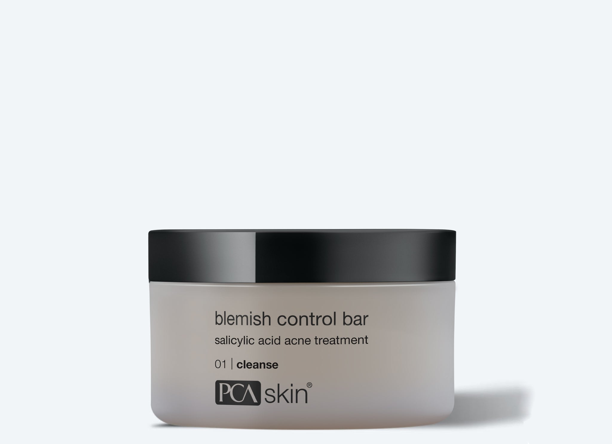 A container of PCA Skin Blemish Control Bar, a salicylic acid acne cleanser with a black lid and white label, pairs perfectly with the Detoxifying Mask to promote clearer, healthier-looking skin.