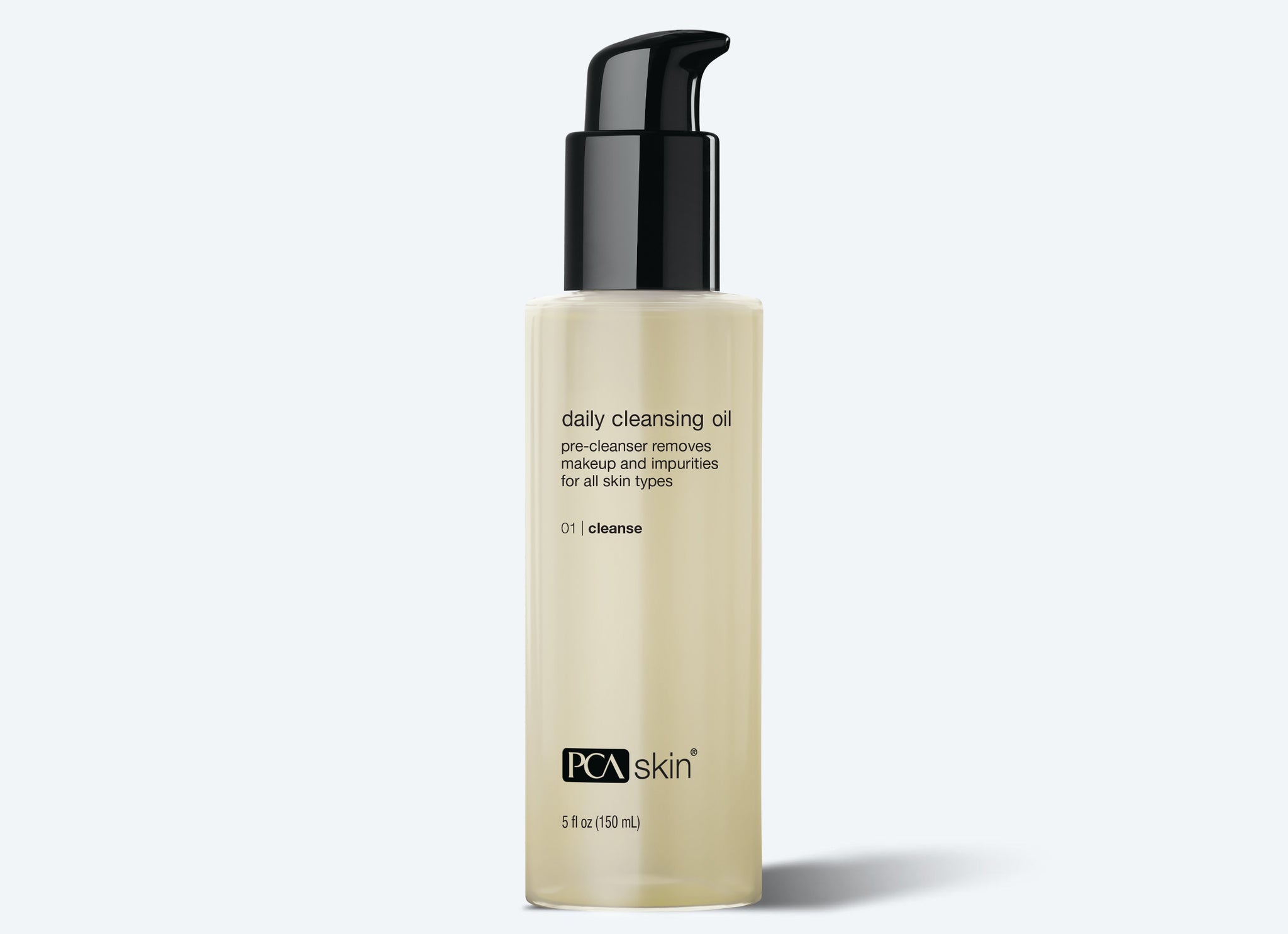 A clear bottle of PCA Skin Daily Cleansing Oil with a black pump stands on a light gray background—perfect to use before applying the Detoxifying Mask.