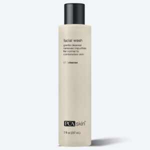 A beige bottle of PCA Skin Facial Wash with a black cap is shown. This gentle cleanser for normal to combination skin pairs well with the Detoxifying Mask for a complete skincare routine. Available in a 7 fl oz (207 mL) size.