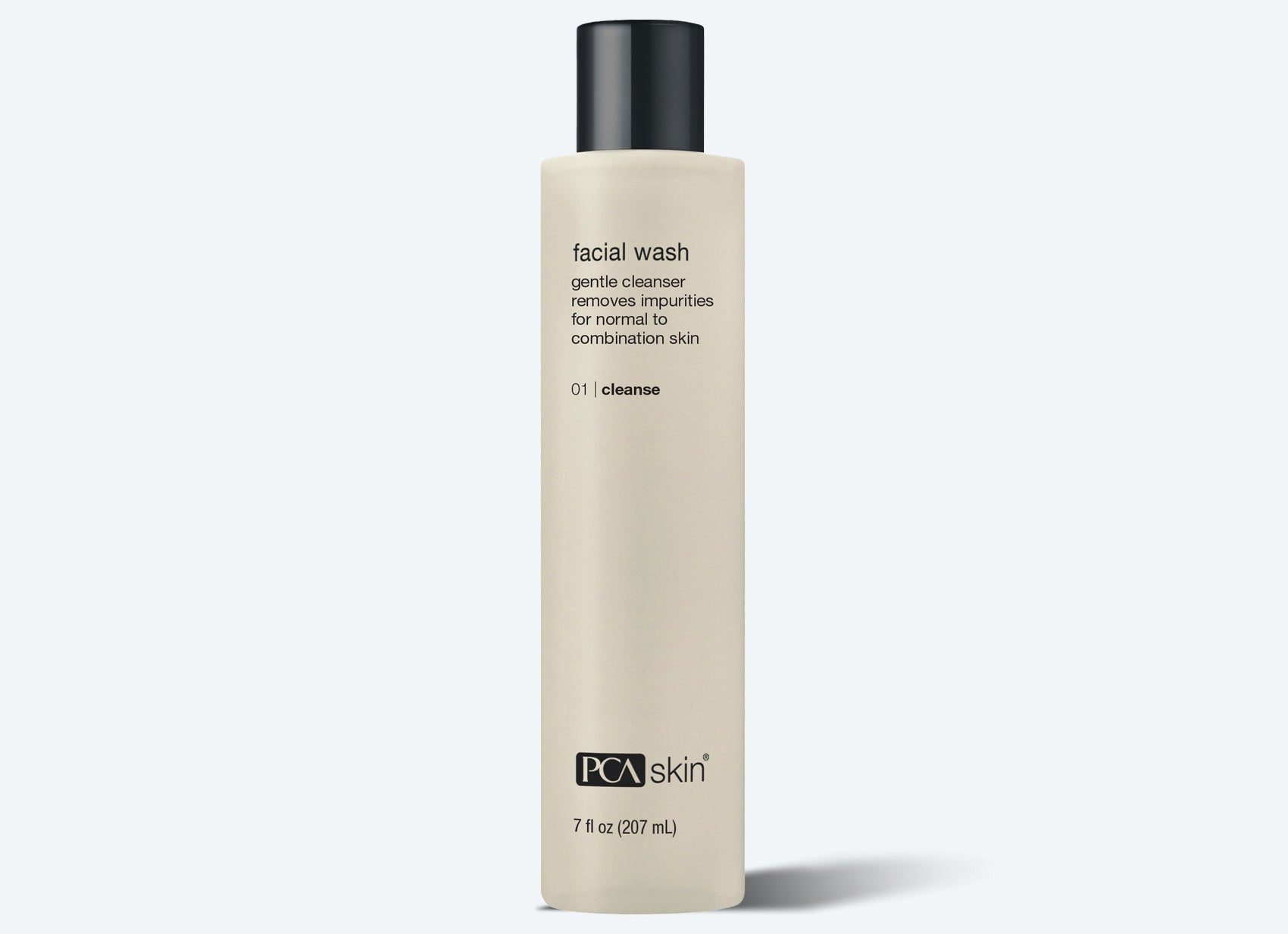 A beige bottle of PCA Skin Facial Wash with a black cap is shown. This gentle cleanser for normal to combination skin pairs well with the Detoxifying Mask for a complete skincare routine. Available in a 7 fl oz (207 mL) size.
