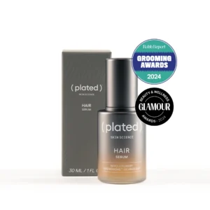 A bottle of Plated Skin Science Hair Serum (30 mL) is shown by its box with Robb Report Grooming Awards 2024 and Glamour Beauty & Wellness Awards 2024 badges. For healthy, revitalized hair, use Hair Serum after the Detoxifying Mask.