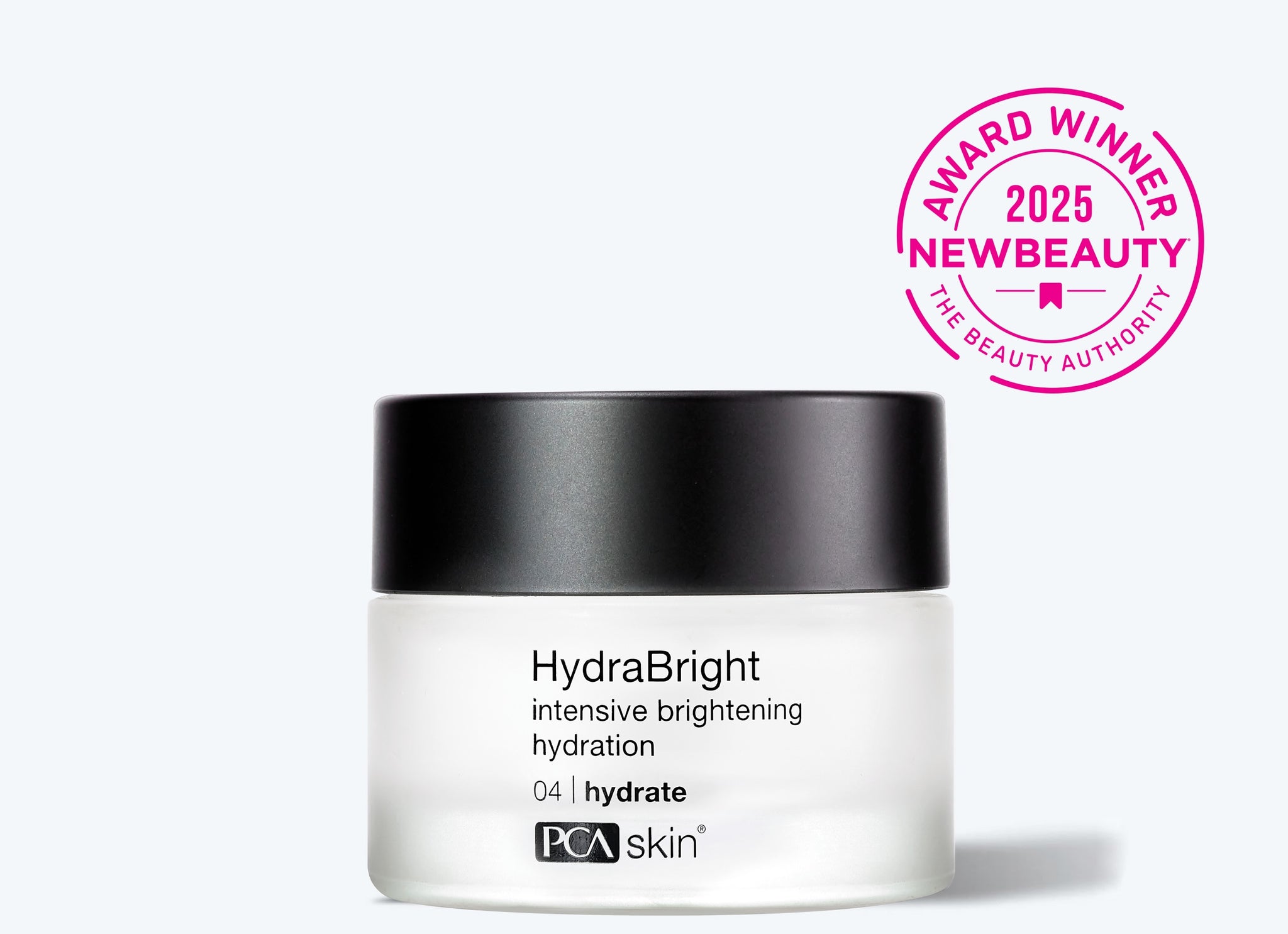 A jar of Detoxifying Mask with a black lid sits beside a pink 2025 NewBeauty Award Winner seal. Its light gray backdrop highlights this skincare essential—perfect to pair with your favorite hydrating cream.