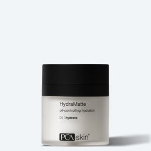 A jar of Detoxifying Mask with a black lid and white label sits on a light gray background—ideal for pairing with your favorite hydrating cream to achieve balanced, shine-free skin.