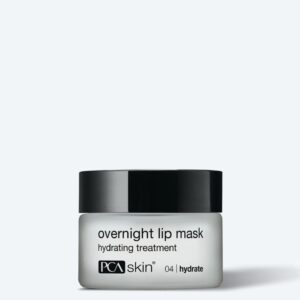 A small jar of Detoxifying Mask with a black lid and white label featuring black text is shown against a light gray background, resembling a mini face mask or detoxifying treatment.