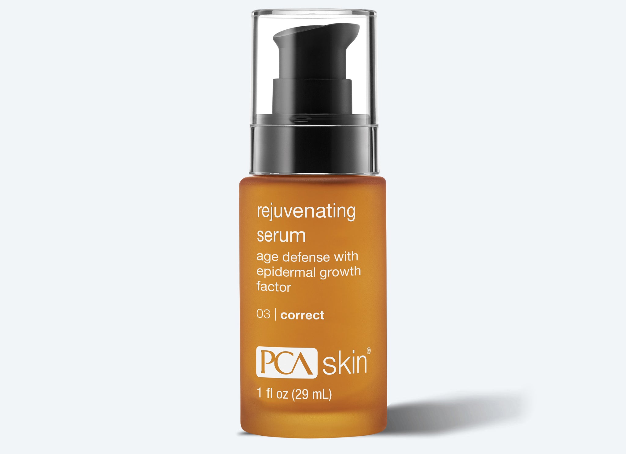 A bottle of PCA Skin Rejuvenating Serum with a black pump dispenser and amber label pairs perfectly with your Detoxifying Mask routine for age defense and epidermal growth factor benefits. 1 fl oz (29 mL).