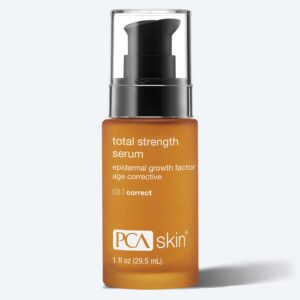 A brown glass bottle of PCA Skin Total Strength Serum with a black pump dispenser and white text, labeled as an age corrective epidermal growth factor serum, is shown next to a Detoxifying Mask against a light background.